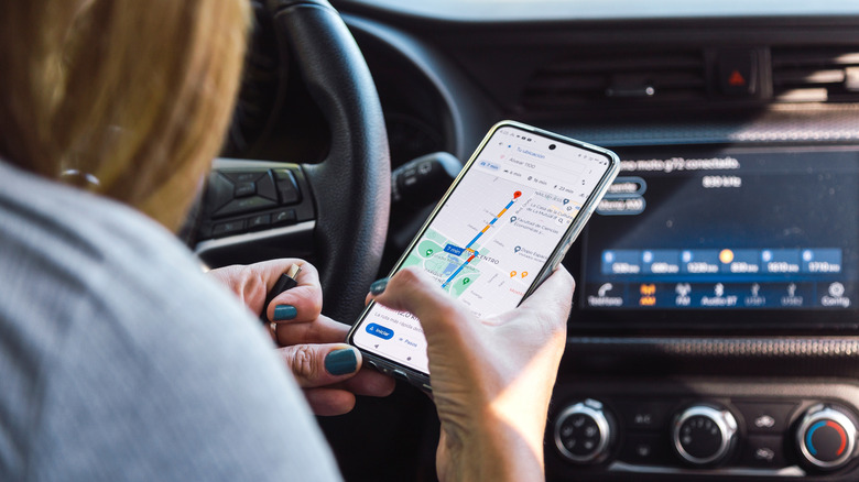 woman navigating google maps on her smartphone