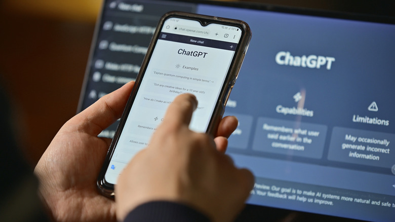 a person utilizing chatgpt on their smartphone and computer display