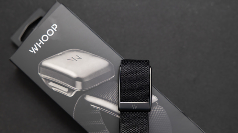 A Whoop band displayed on its packaging