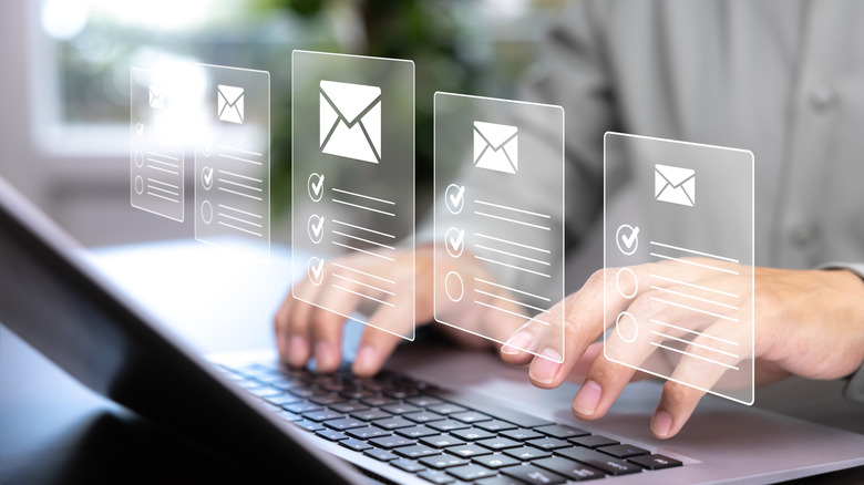 Two hands typing on a laptop with overlaid graphics of multiple email columns featuring check-marked lists on the user's hands