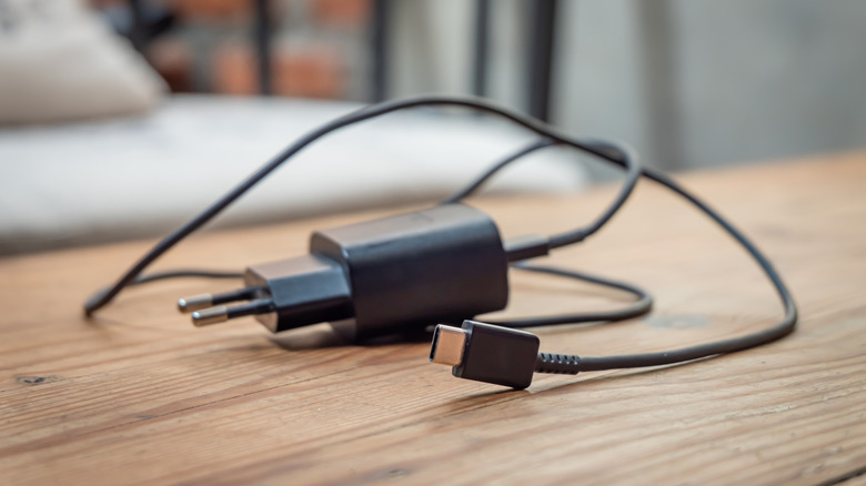 A black USB C charger with a European power adapter.