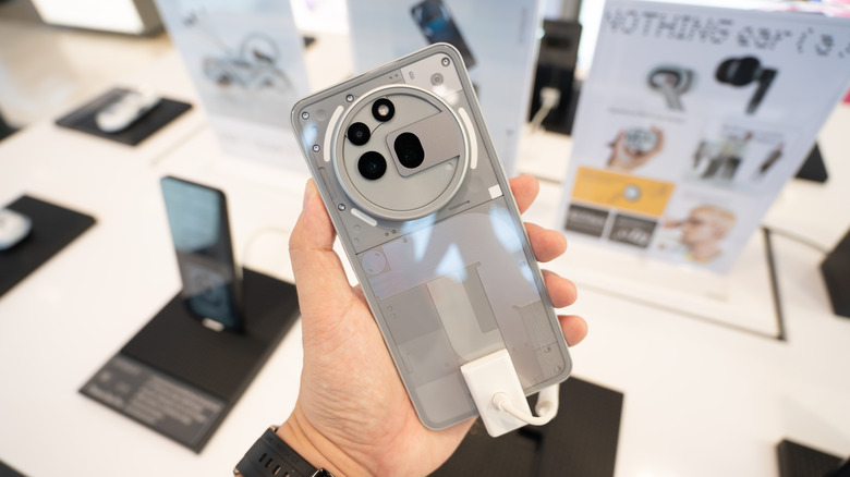 The Nothing Phone 3a Pro, a mid-range Android phone, is depicted.