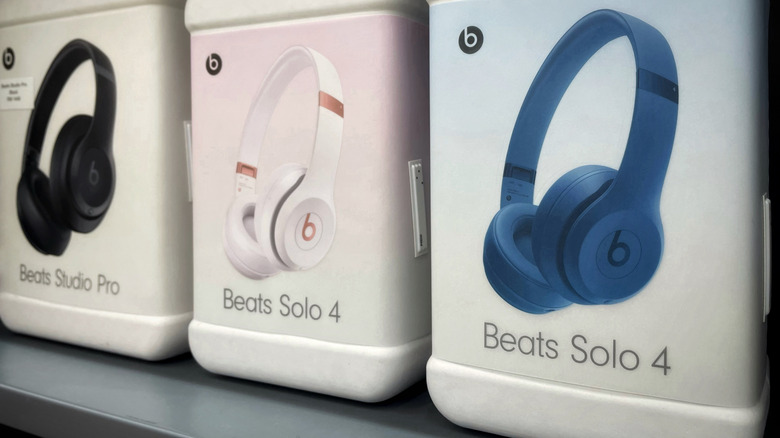 A variety of Beats headphones displayed on a shelf