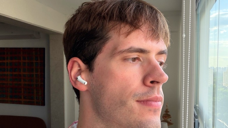 A person utilizing AirPods Pro 3