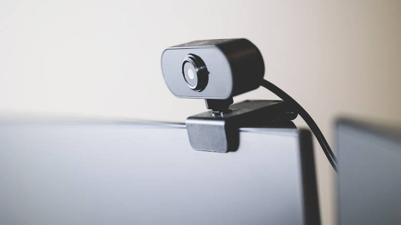 An external webcam positioned on a desk, illustrating increased adaptability for video calls.